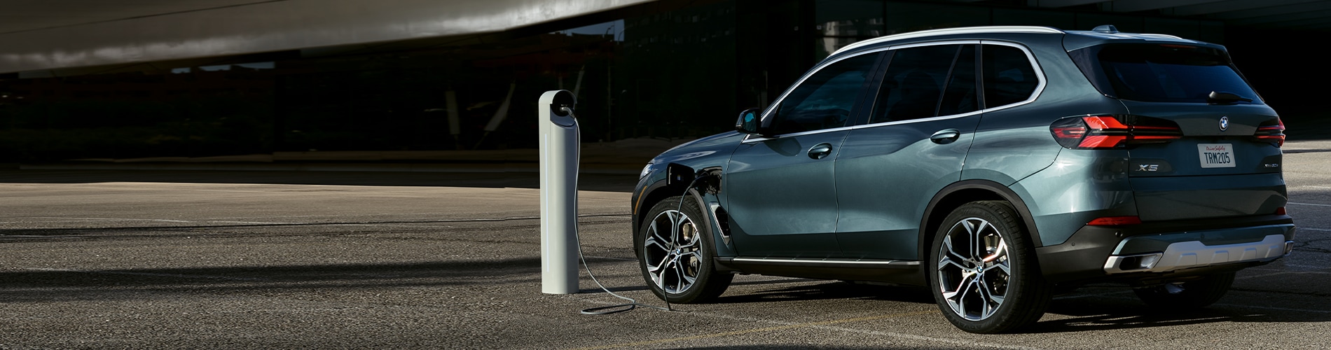 Parked BMW X5 charging