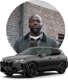 Image of Justin and his BMW Model.
