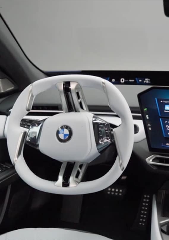 Close up of BMW i3 Central display and steering wheel.
