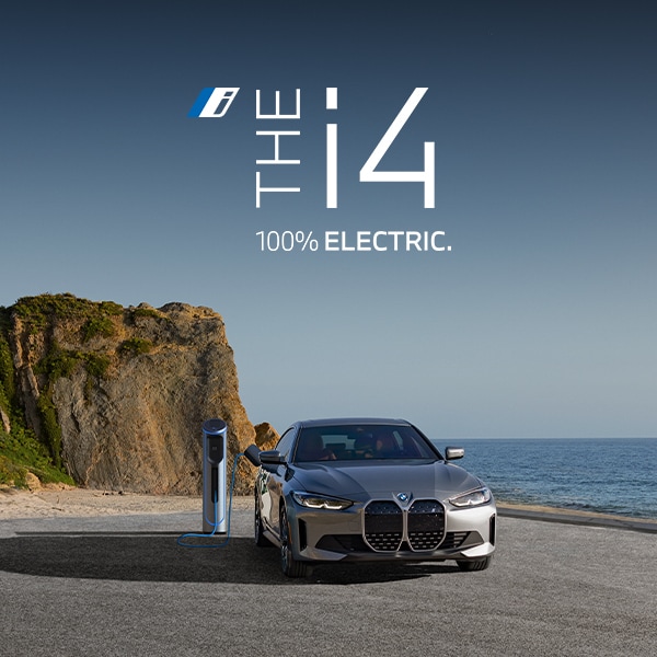 The-i4.jpg Charging BMW i4 parked in coastal landscape