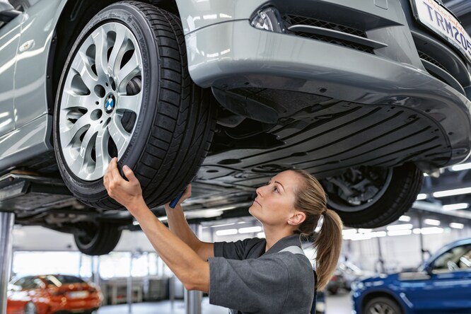Woman Servicing Tire