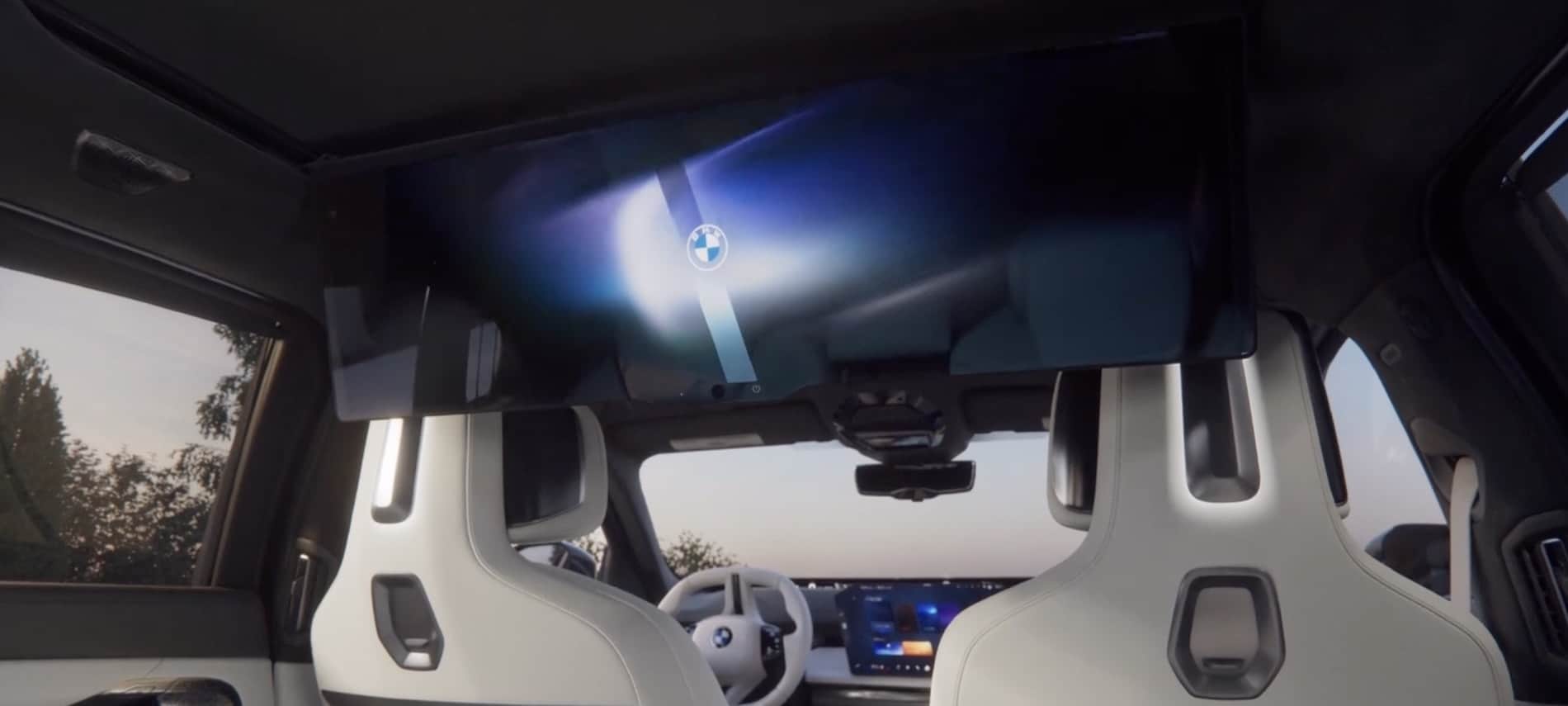 2027 BMW 7 Series Sedan interior, BMW Theatre Screen lowered from the roof