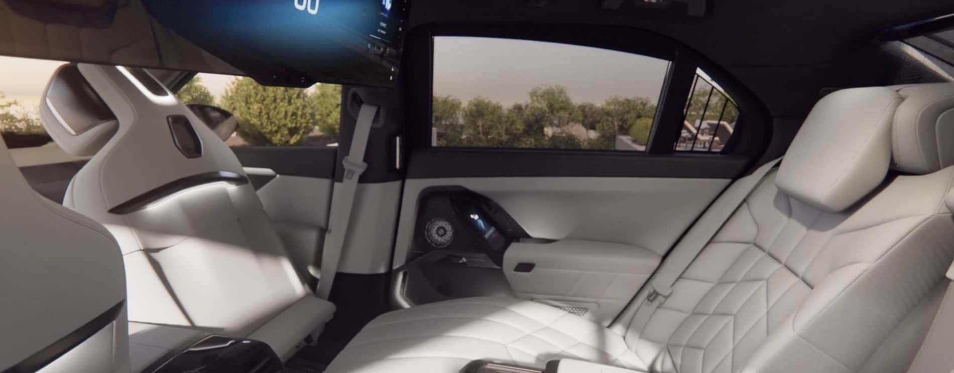 2027 BMW 7 Series Sedan interior, rear lounge with the ceiling screen and rear door panel