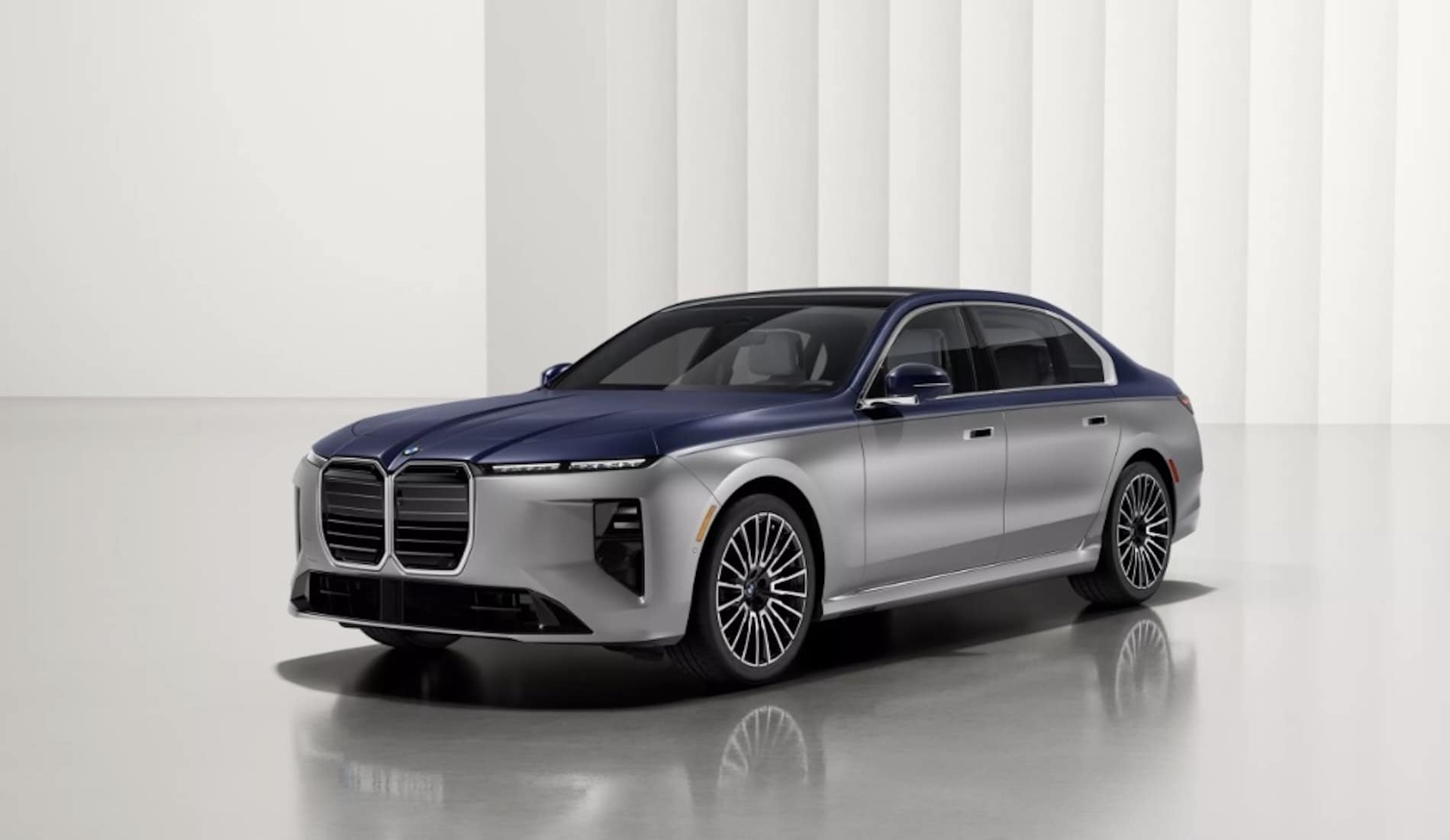 2027 BMW 7 Series Sedan exterior in blue over silver two-tone, front three-quarter view