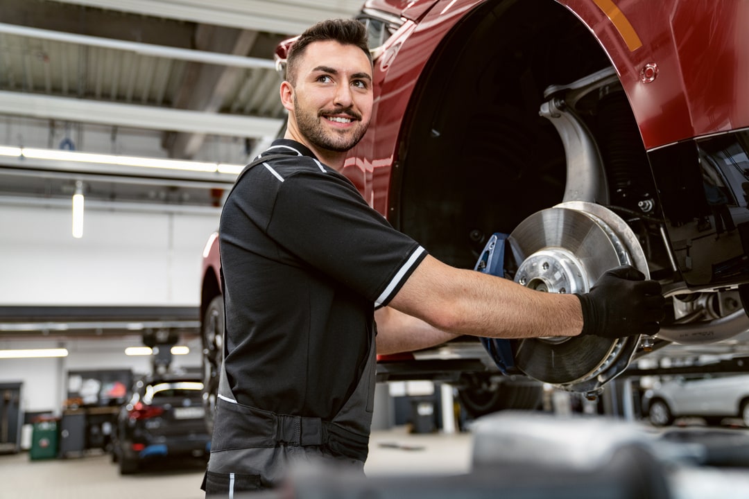  Person cheerfully signing documents.