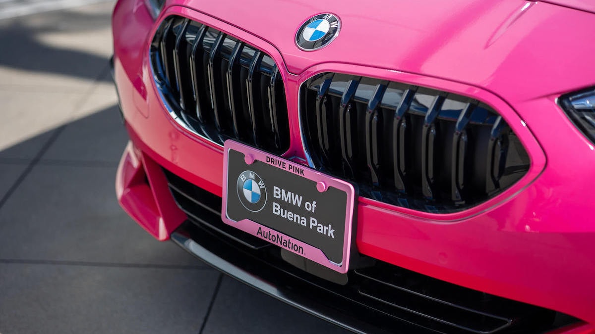 Pink BMW with AutoNation license plate frame at BMW of Buena Park