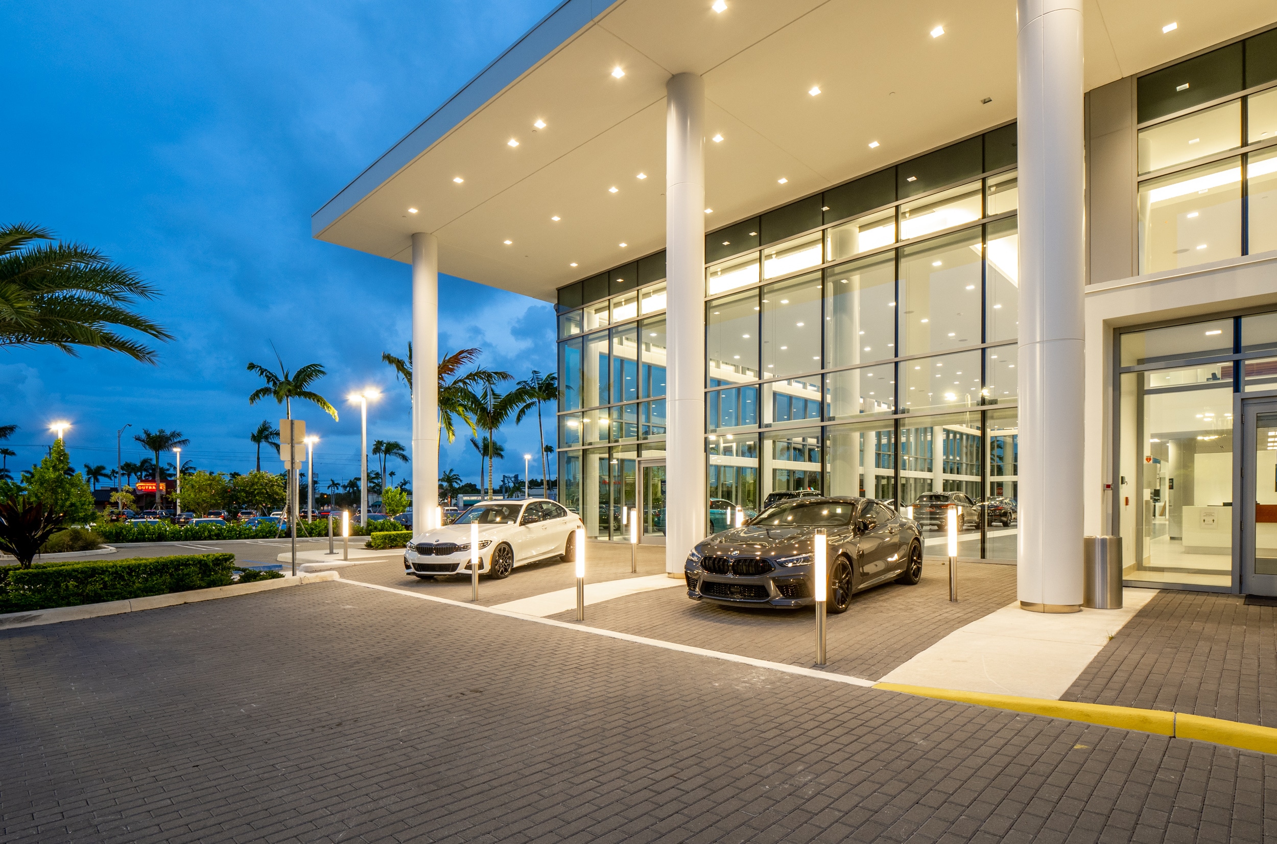 Exterior view of BMW of Delray Beach 
in the evening
