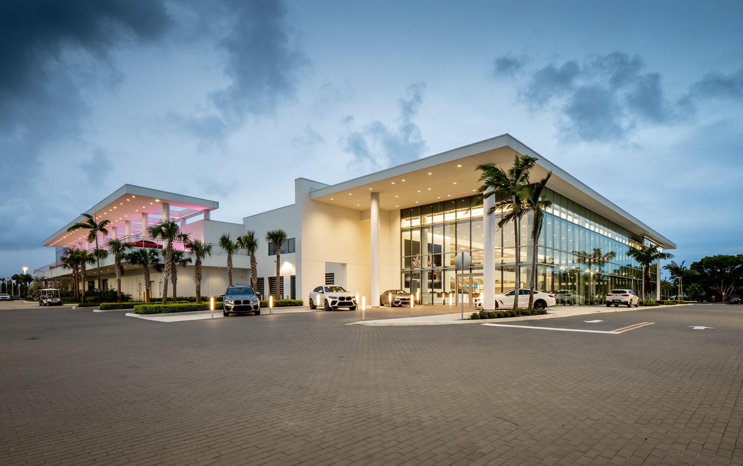 Exterior view of BMW of Delray Beach in the evening