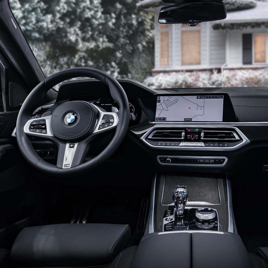 2024 BMW X5 Dashboard, Steering Wheel, and Infotainment Touchscreen.