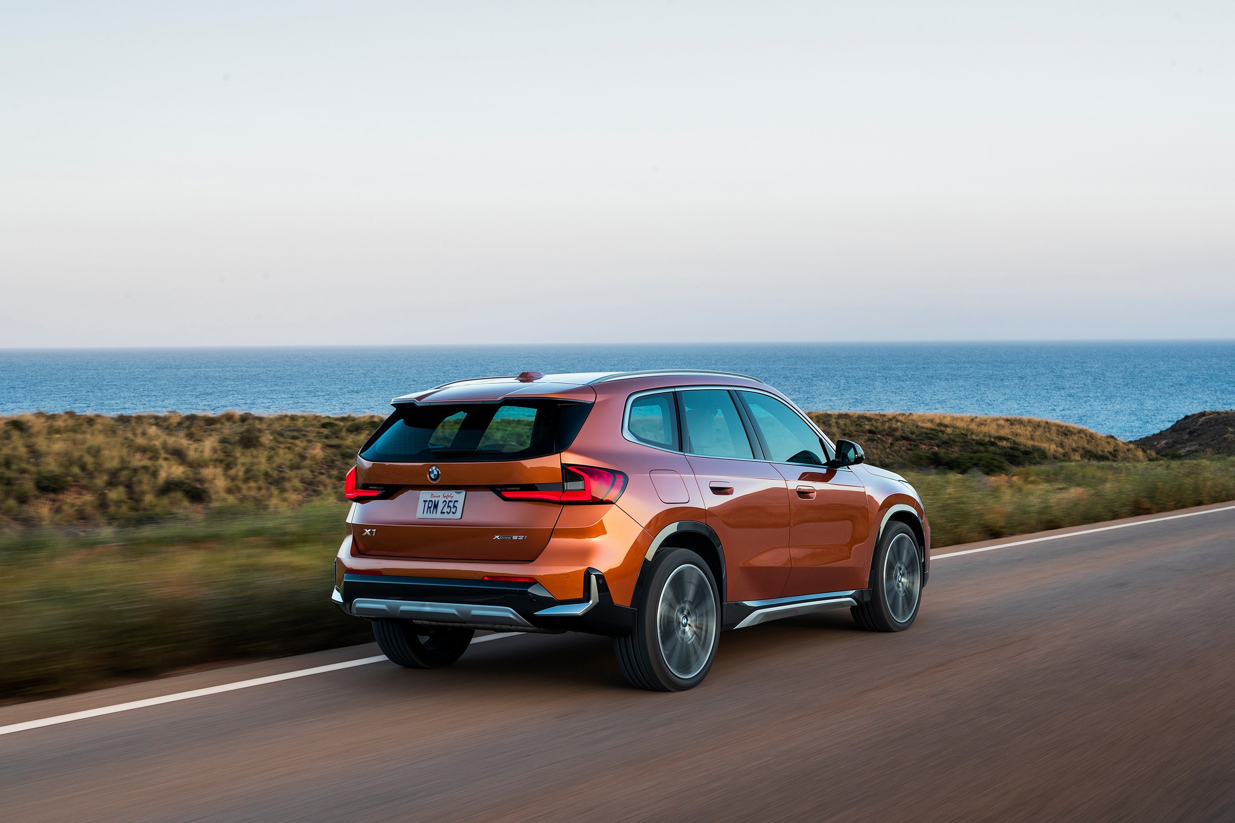 2023-BMW-X1-Exterior-Orange-Back.jpg