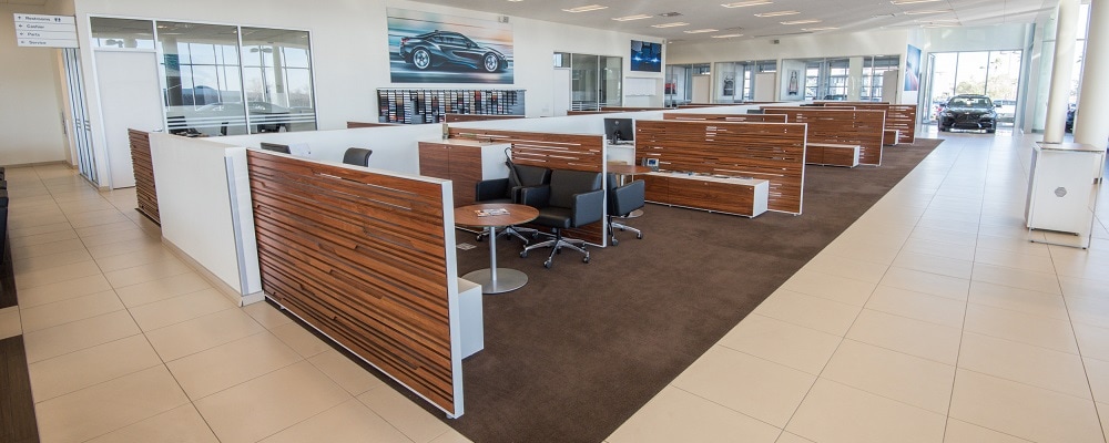 Several bays of desks and chairs inside BMW of Henderson.