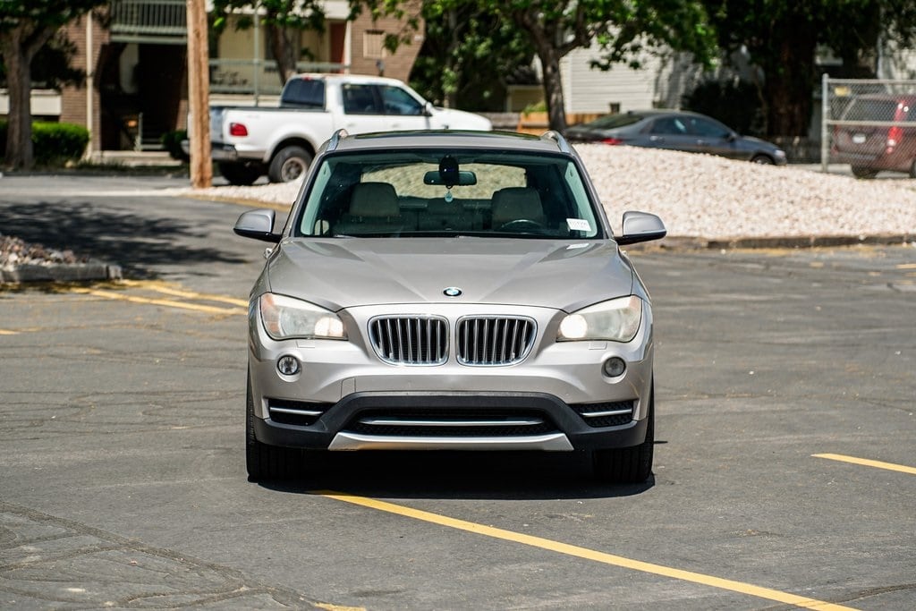 Used 2013 BMW X1 28i with VIN WBAVL1C58DVR84787 for sale in Murray, UT