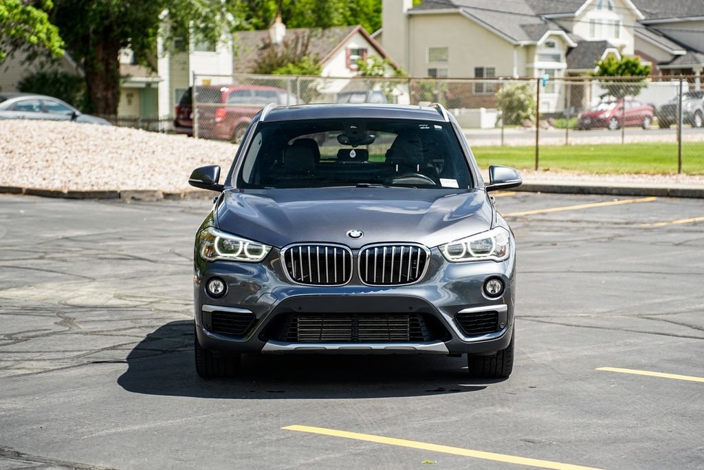 Used 2017 BMW X1 28i with VIN WBXHT3Z35H4A57085 for sale in Murray, UT