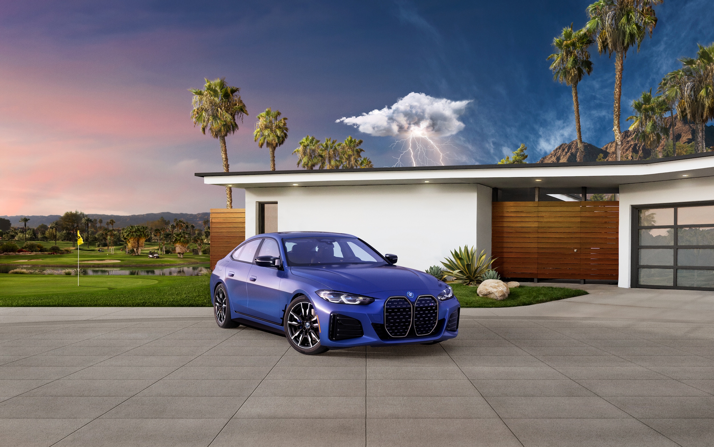 Blue BMW i4 in driveway