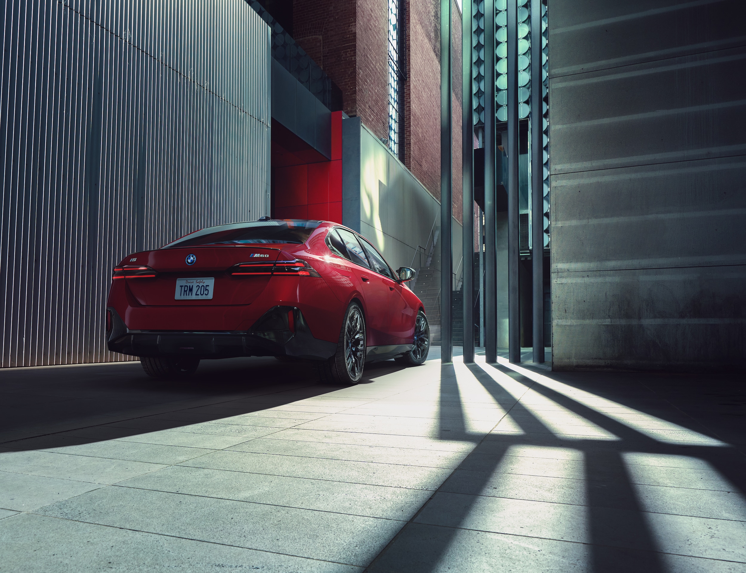 BMW i5 driving in city