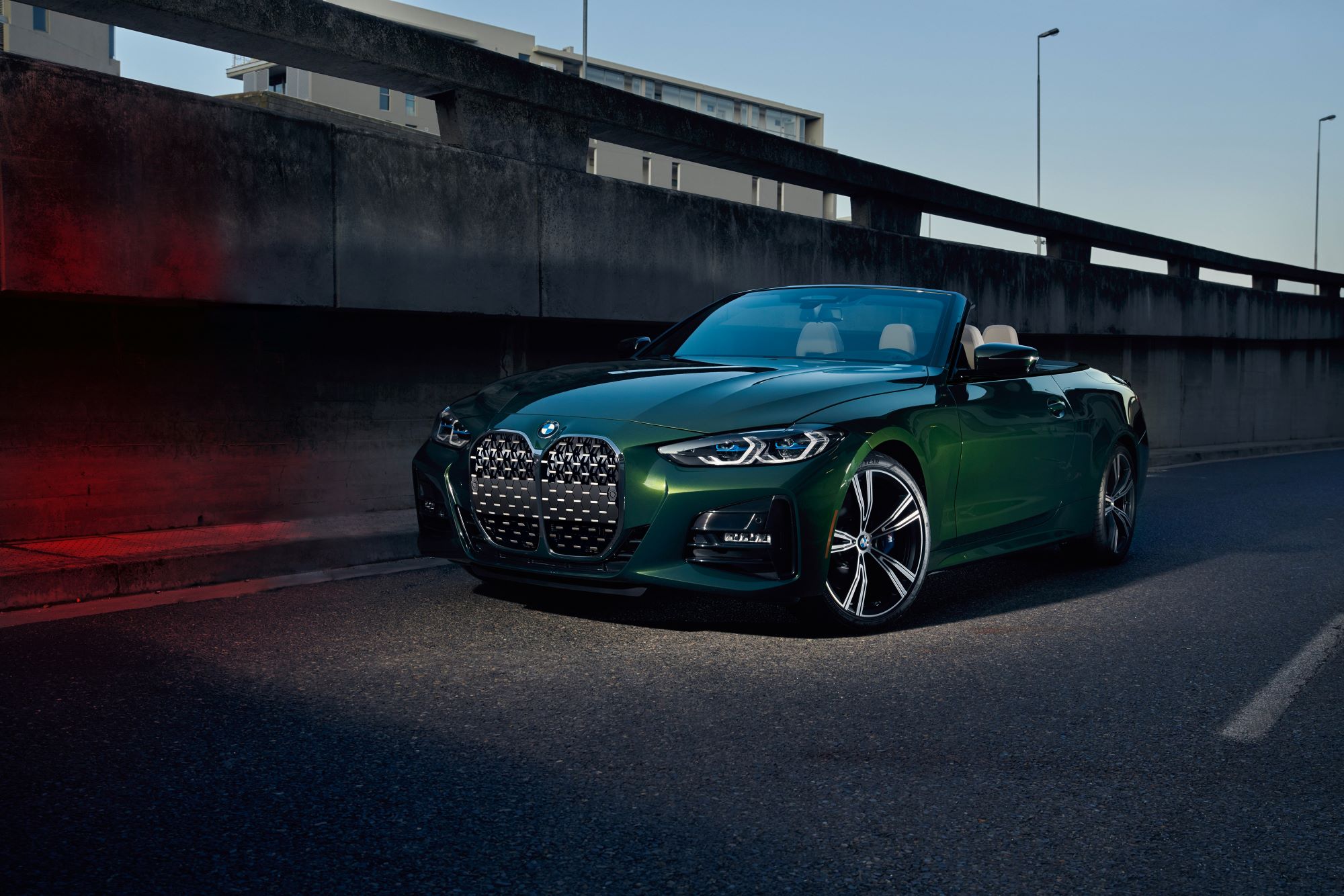  Green BMW M440i driving on road