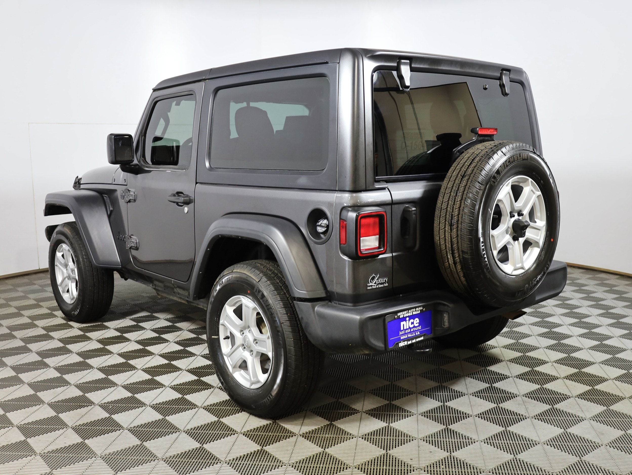 Used 2023 Jeep Wrangler 2-Door Sport S with VIN 1C4GJXAN7PW588601 for sale in Sioux Falls, SD