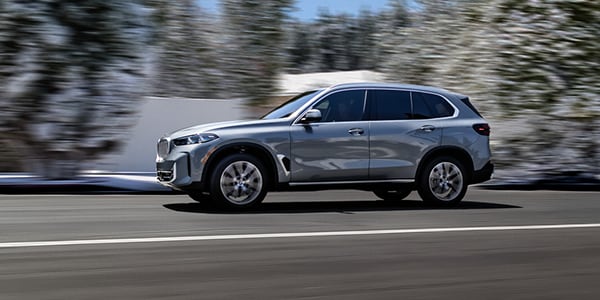  Person cheerfully signing documents.