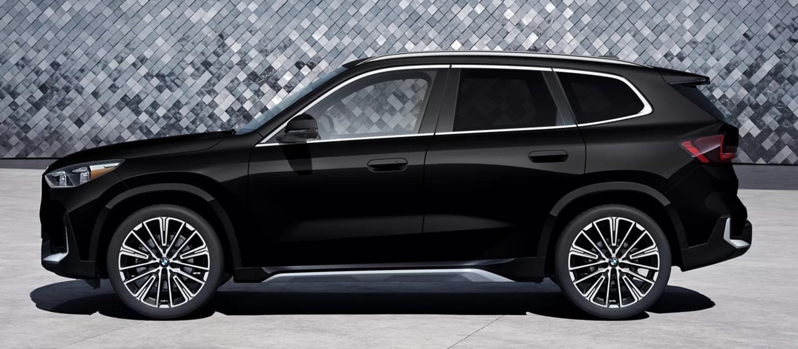 2026 BMW X1 parked in front of a mosaic wall