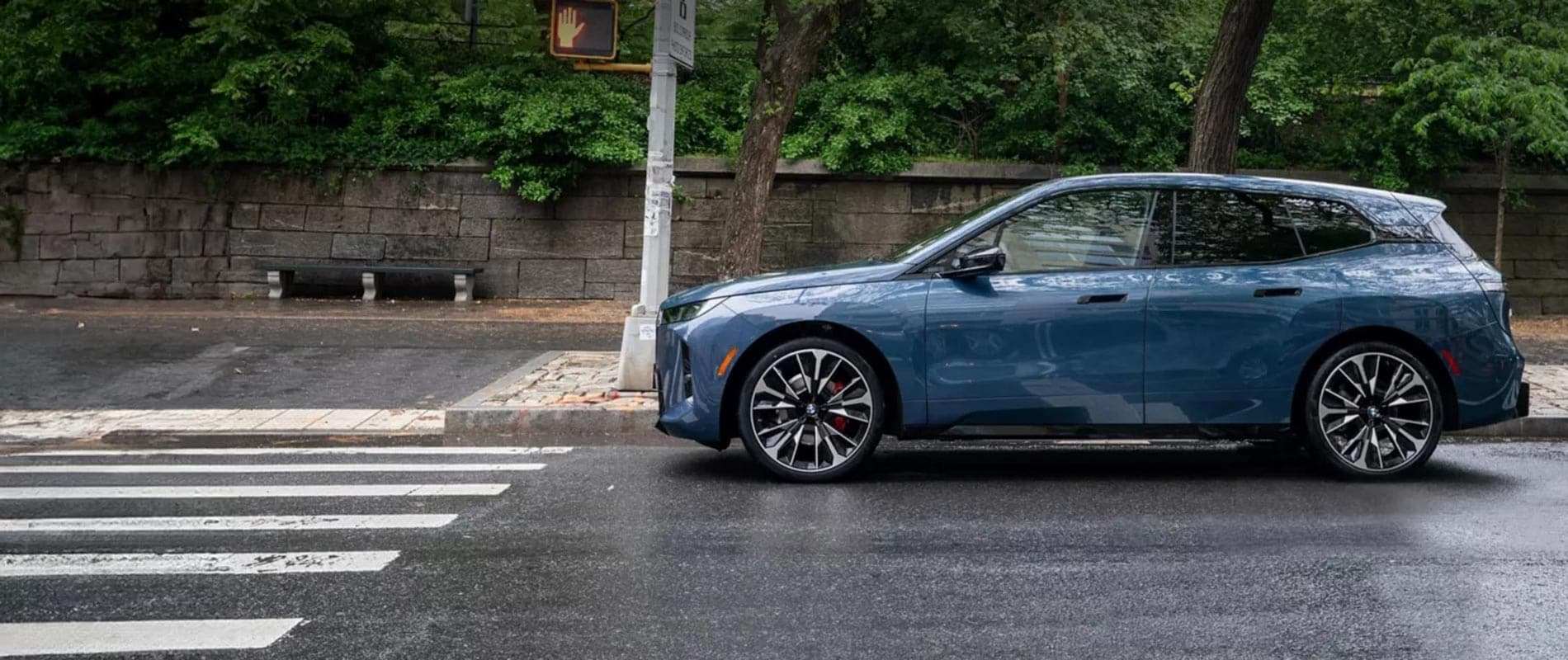 Learn About & Pre-Order the New BMW iX Near Williamsport, PA 2025 BMW iX stopped at a crosswalk