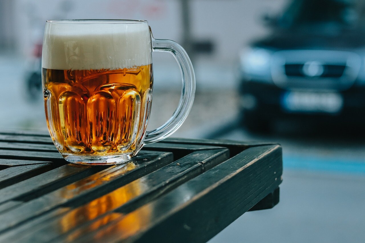 Mug of beer sitting on a table at a brewery.jpg