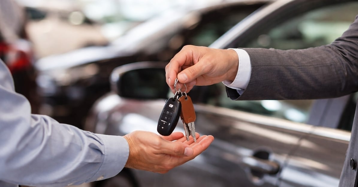 Passing%20smart%20car%20keys%20to%20a%20client.png