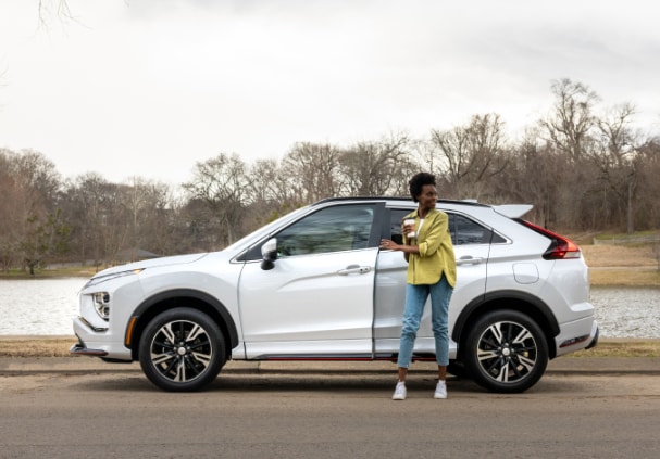 Woman getting out of her Mitsubishi