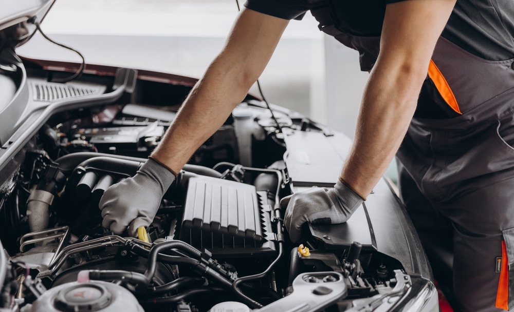 Dealership%20or%20Mechanic%20Expert%20Working%20on%20a%20Foreign%20Car.jpg