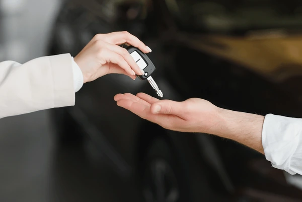 businessman-exchange-handing-over-car-600nw-2185382355.webp