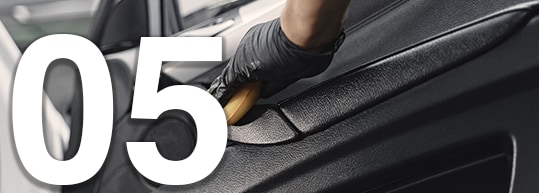 Tips for Spring Cleaning Your Car at Bobby Rahal Acura | 05 Wiping down interior of Car Door