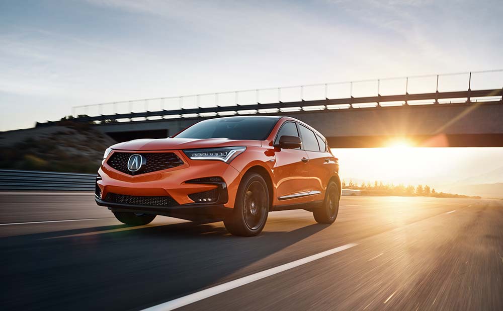 Why drivers should consider an extended warranty on their Acura at Bobby Rahal Acura | 2021 Acura RDX driving at sunset