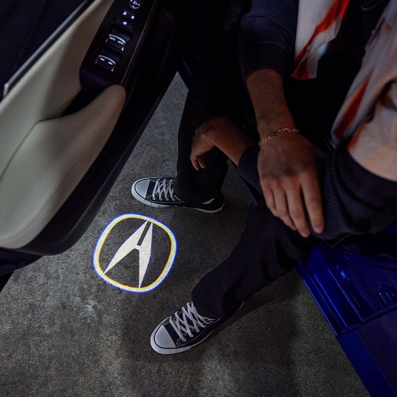 All-New 2023 Acura Integra at Bobby Rahal Acura | Acura Emblem Projecting Onto Ground When Driver's Side Door is Open in the 2023 Acura Integra