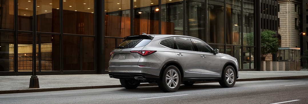 Compare the 2020 Acura MDX and the 2022 Acura MDX at Bobby Rahal Acura | MDX parked in city