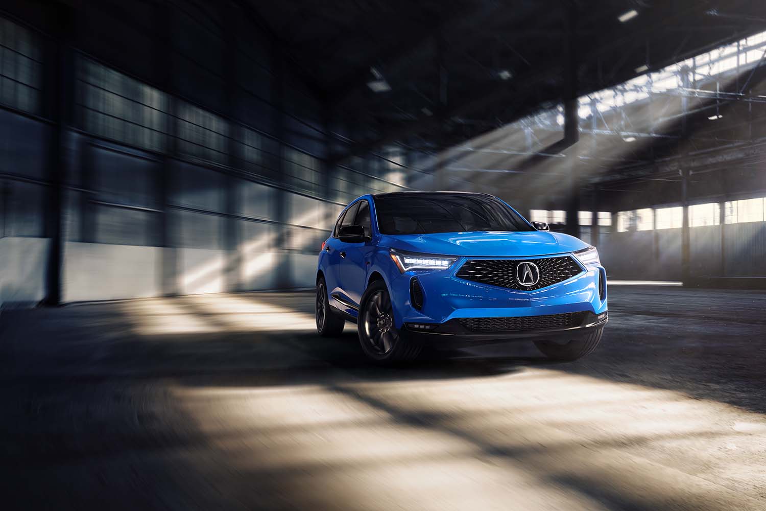 2022 Acura RDX driving in an empty parking garage