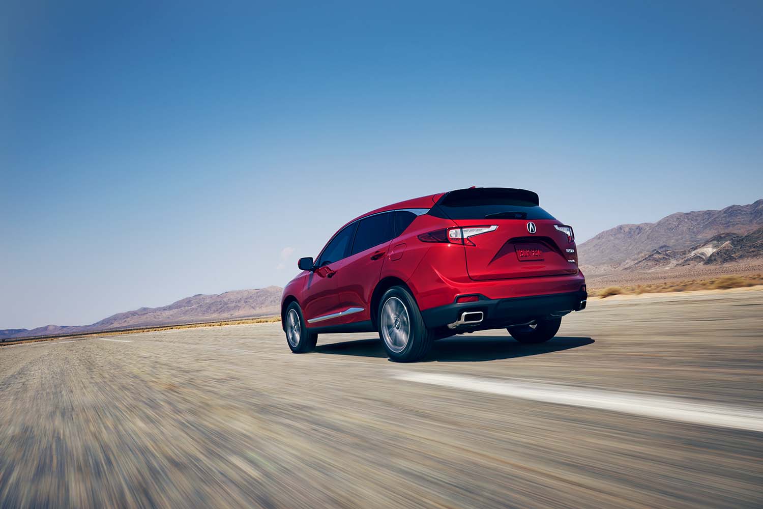 All-New 2022 Acura RDX at Bobby Rahal Acura | 2022 Acura RDX driving away from camera in desert
