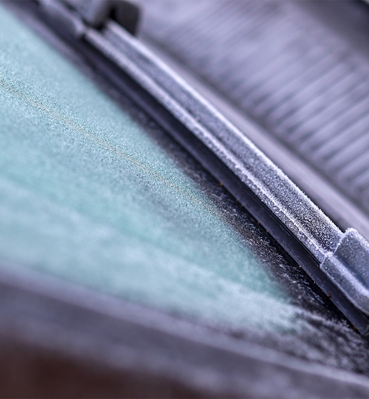 How to Prevent your Vehicle from Fogging Up At Bobby Rahal Acura in Mechanicsburg, PA | Close up detail of frosted windshield and wiper blade 