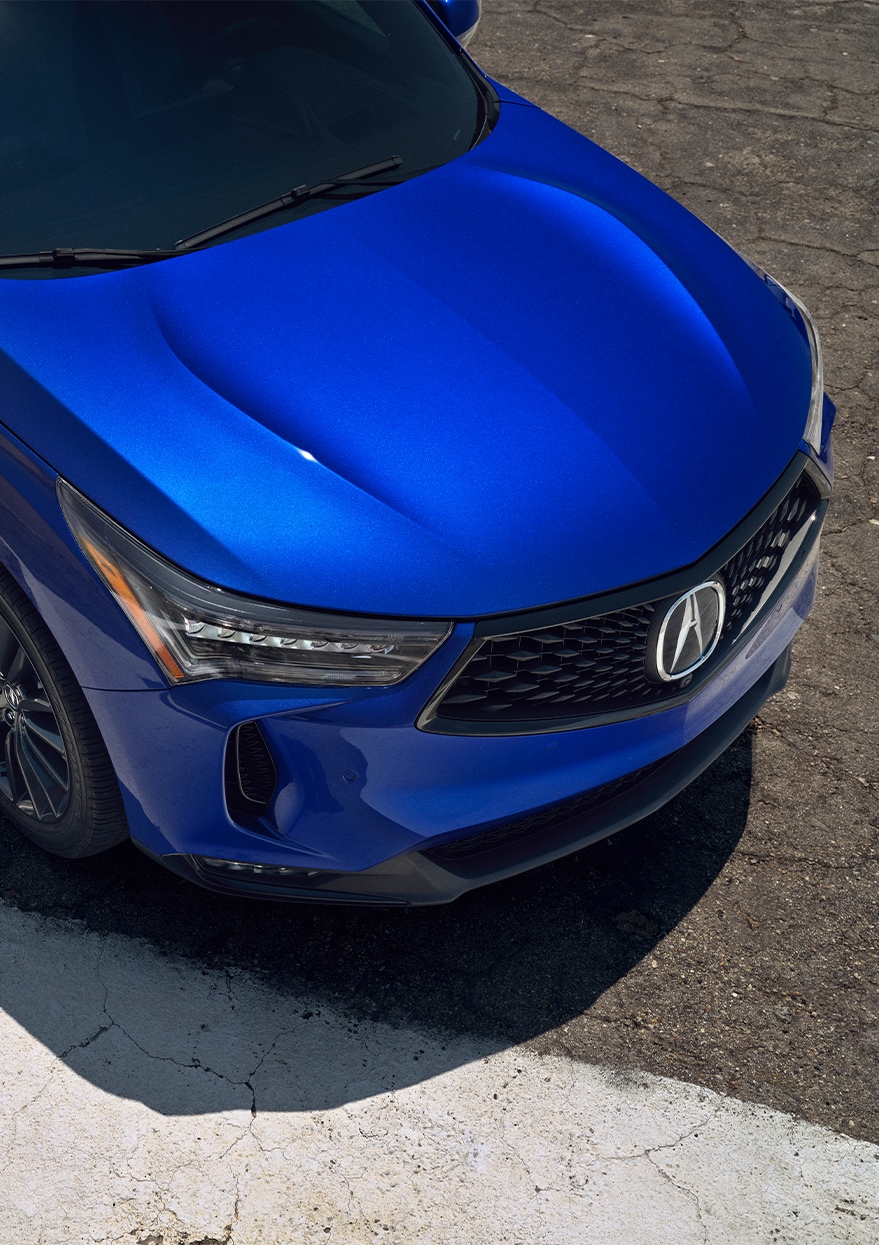 New 2023 Acura RDX at Bobby Rahal Acura | View of the front hood of a 2023 Acura RDX in the color blue  