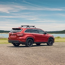 Model Features of the 2021 Toyota Highlander at Bobby Rahal Toyota | Highlander parked by water's edge