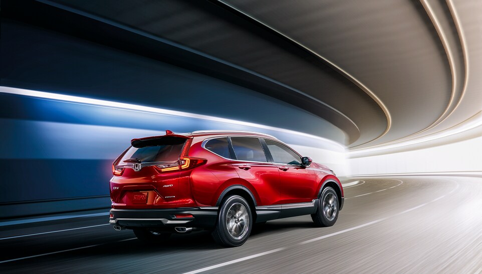 The Top 3 Most Fuel-Efficient Honda Models at Bobby Rahal Honda of State College | Rear view of Honda CR-V driving down a tunnel going fast 