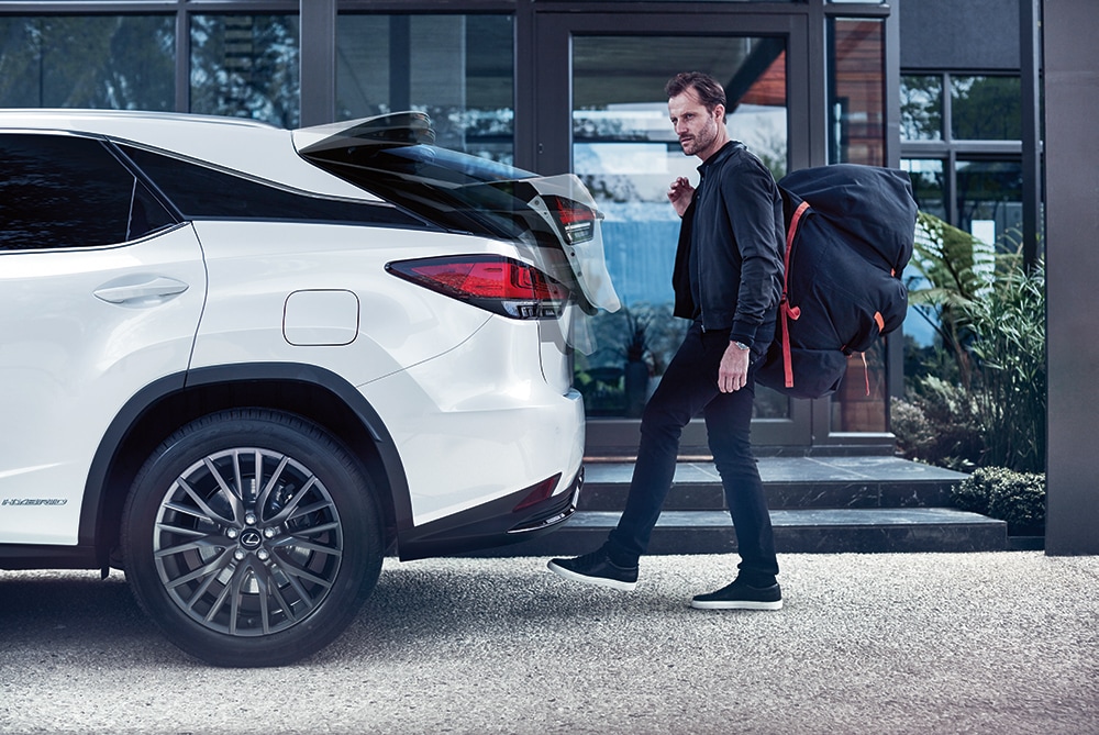 Style and Performance Features of the 2020 Lexus RX at Bobby Rahal Lexus of Lewistown of Lewistown | Man opening trunk of the 2020 Lexus RX hands free