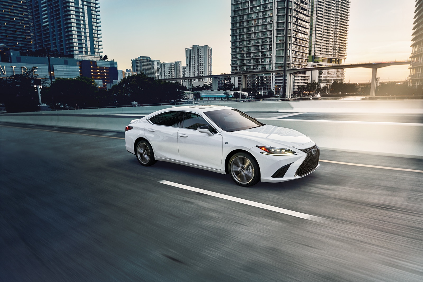 Model Features of the 2020 Lexus ES and ES Hybrid | White 2020 Lexus ES running of road