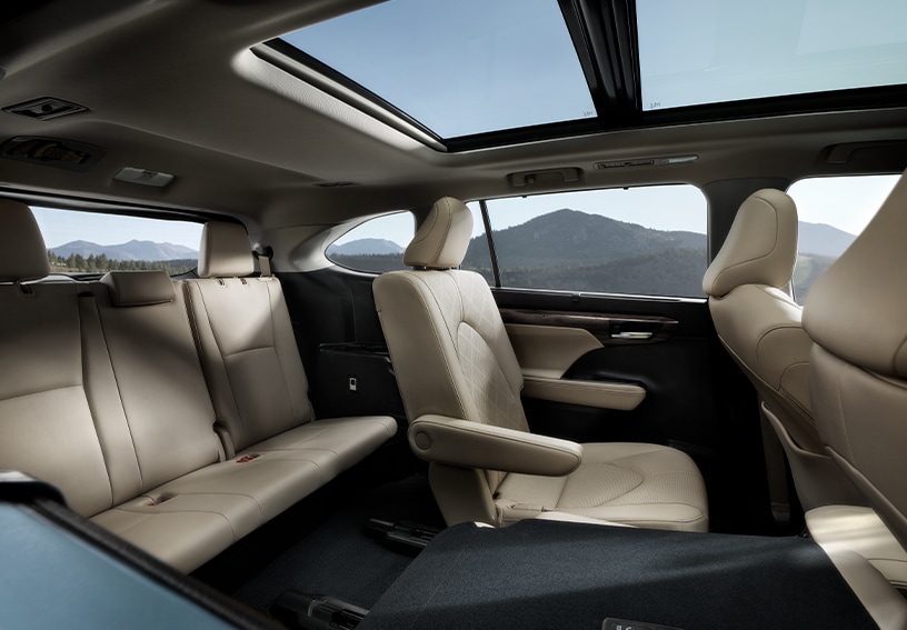 2023 Toyota Highlander at Bobby Rahal Toyota in Mechanicsburg, PA | Interior of rear back seats of a 2023 Toyota Highlander with beige leather seats