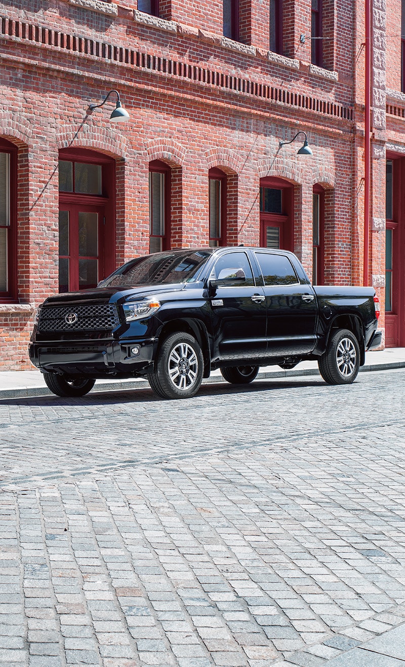The 2022 Toyota Tundra vs. The 2021 Toyota Tundra at Bobby Rahal Toyota | Black 2021 Toyota Tundra Street Parked in City