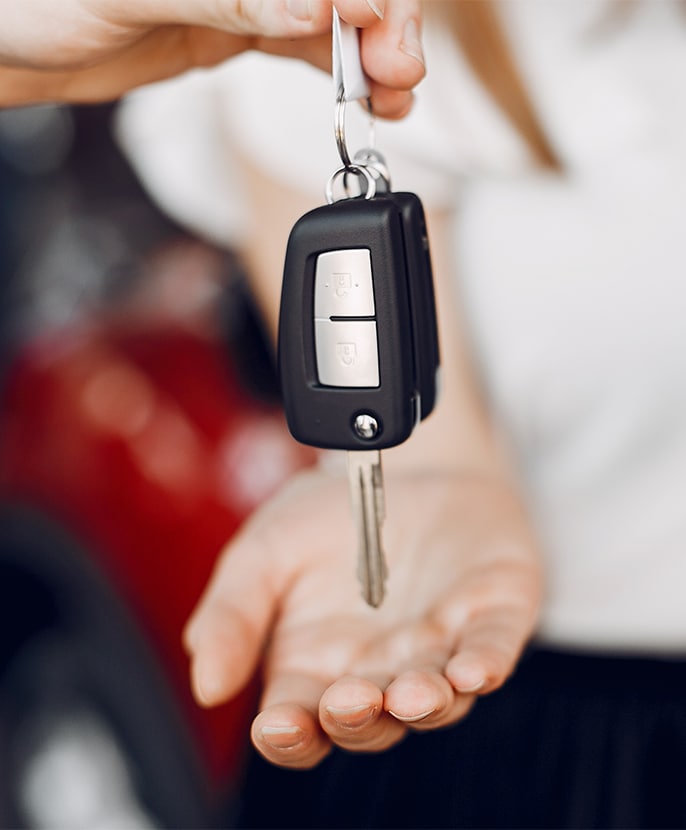 When to Trade In Your Car | Bobby Rahal Toyota in Mechanicsburg, PA | New car keys held by a person while another persons hand is underneath it