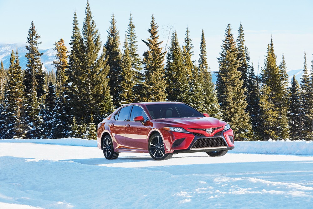 How to prepare your Toyota for the winter season in Mechanicsburg, PA at Bobby Rahal Toyota | 2021 Toyota Camry parked in the snow