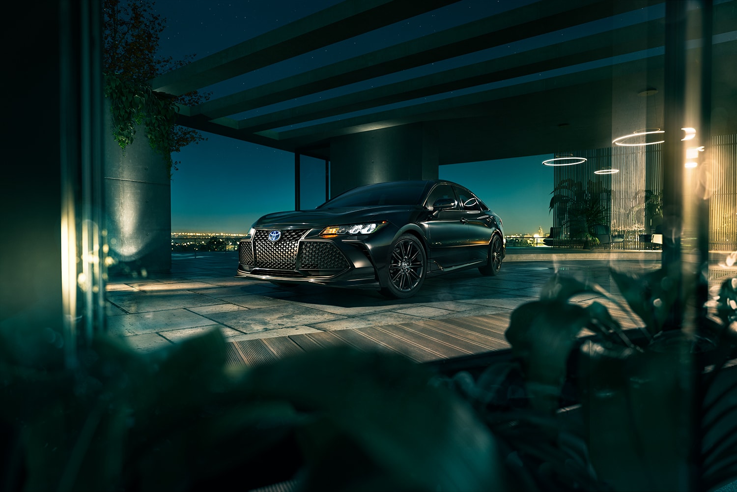 Toyota Hybrid for Everyone at Bobby Rahal Toyota | 2022 Toyota Avalon Hybrid parked in a parking garage at night
