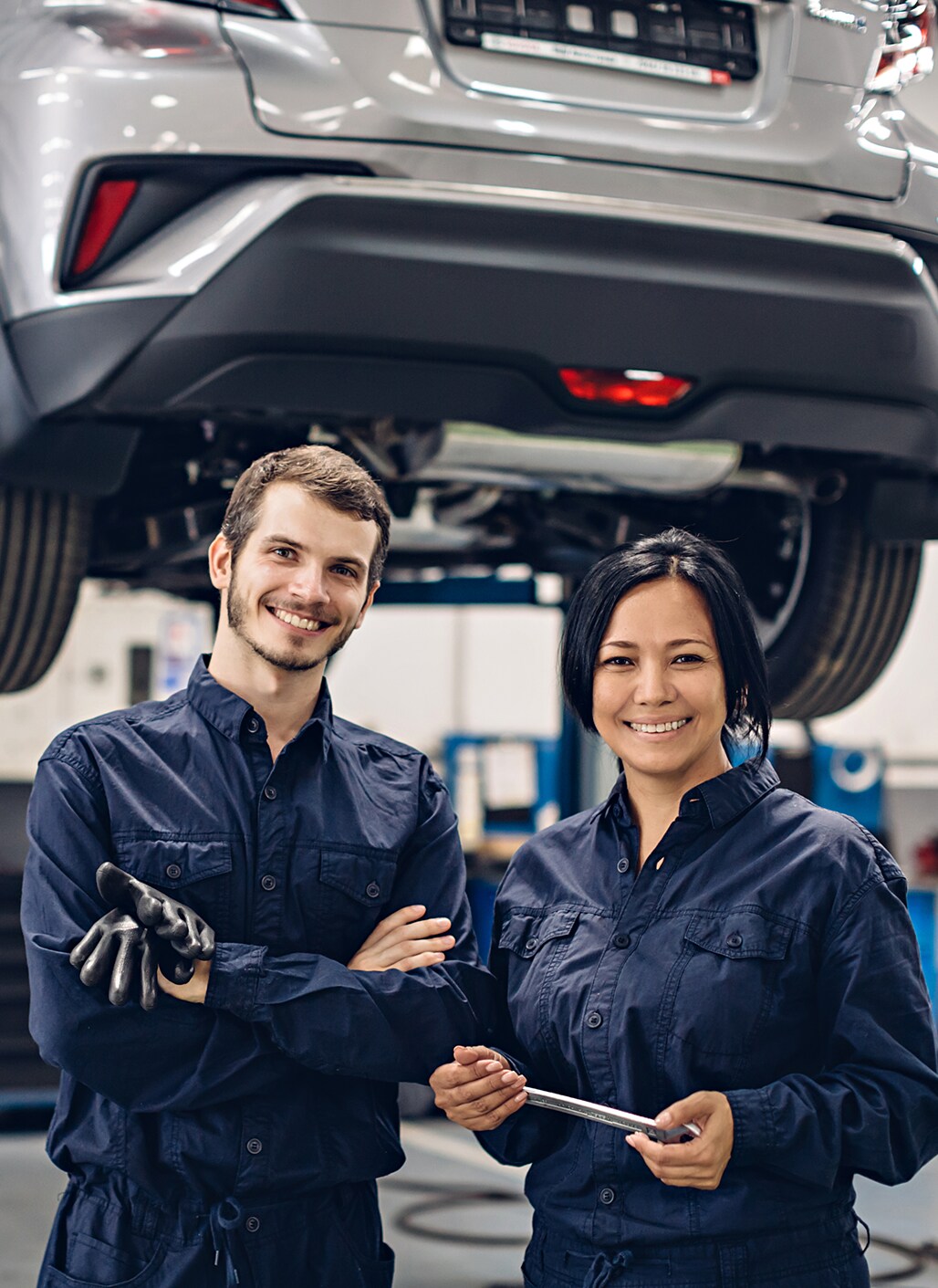 What is included in a Multi-Point Inspection? | Bobby Rahal Toyota in Mechanicsburg, PA | Two mechanics standing side by side to each other wearing navy blue uniforms