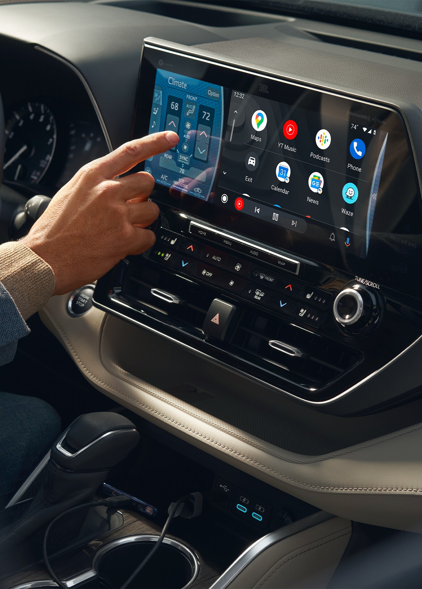 Android Auto vs. Apple CarPlay at Bobby Rahal Toyota in Mechanicsburg, PA | Person's hand using the Android Auto on touch screen