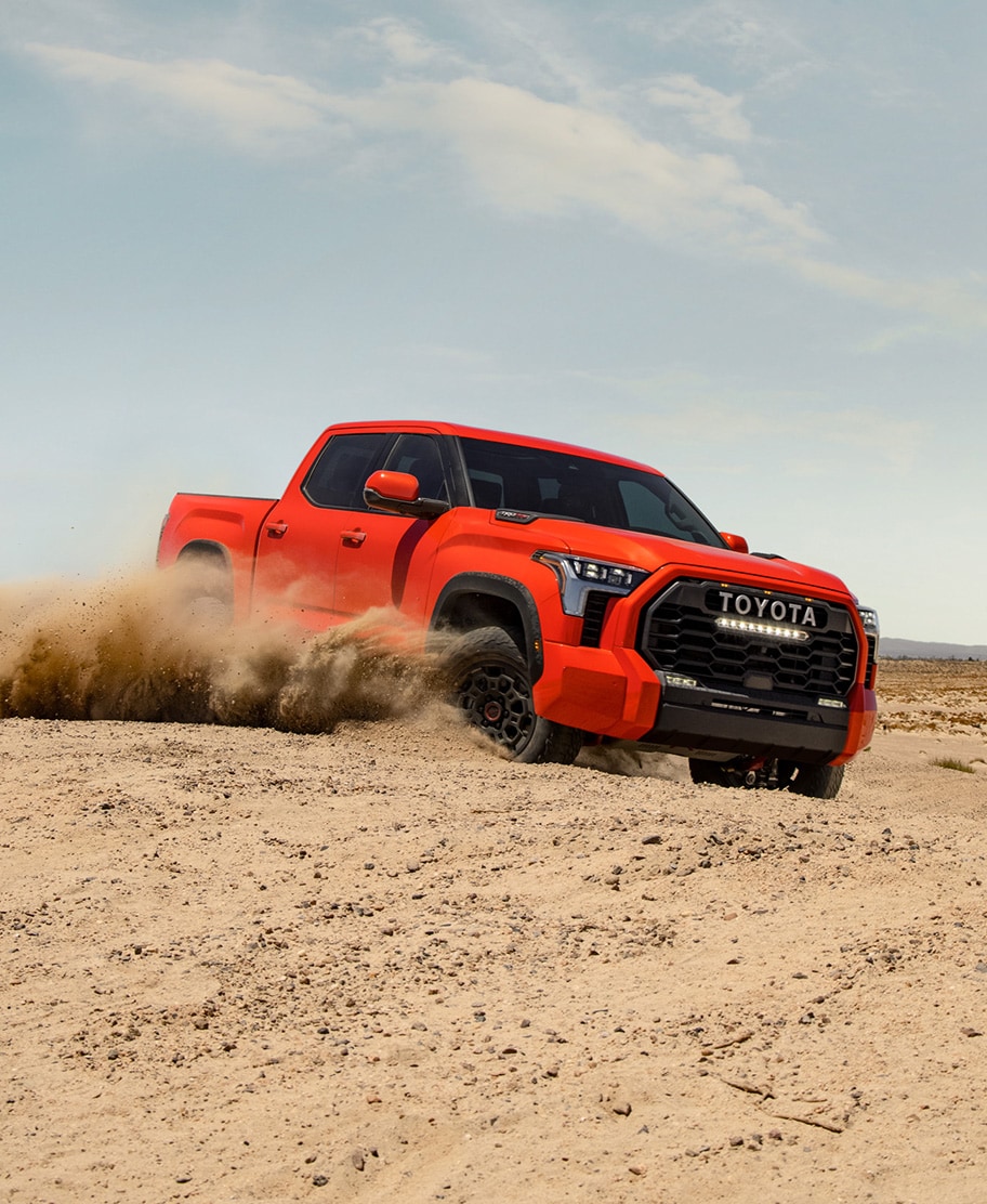 The All-New 2022 Toyota Tundra at Bobby Rahal Toyota in Mechanicsburg, PA | Red 2022 Toyota Tundra TRD Pro Off-Roading In Desert