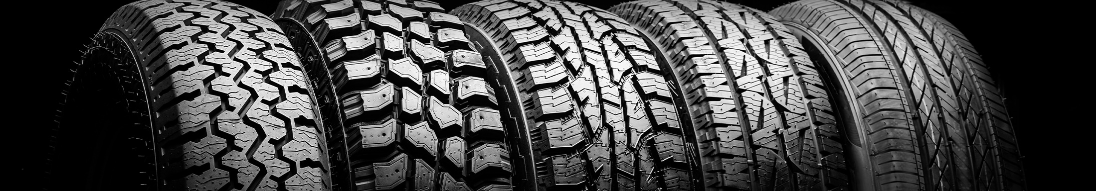 Winter Tires vs. All Season Tires at Bobby Rahal Toyota in Mechanicsburg, PA | Row of different tires next to each other 